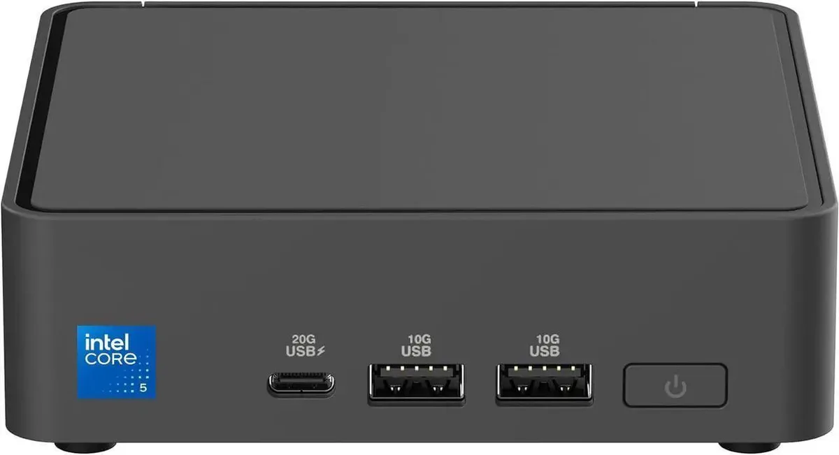 Compact silver mini PC with matte finish and subtle branding