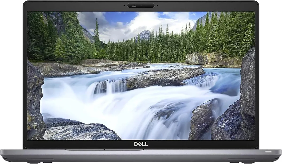 Silver Dell Latitude 5511 15.6 inch laptop, scuffed edges, top scratches, clean screen and keyboard