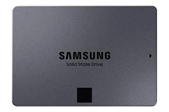 Rectangular 2.5 inch internal SSD with black metal casing and label showing 870 QVO 8TB