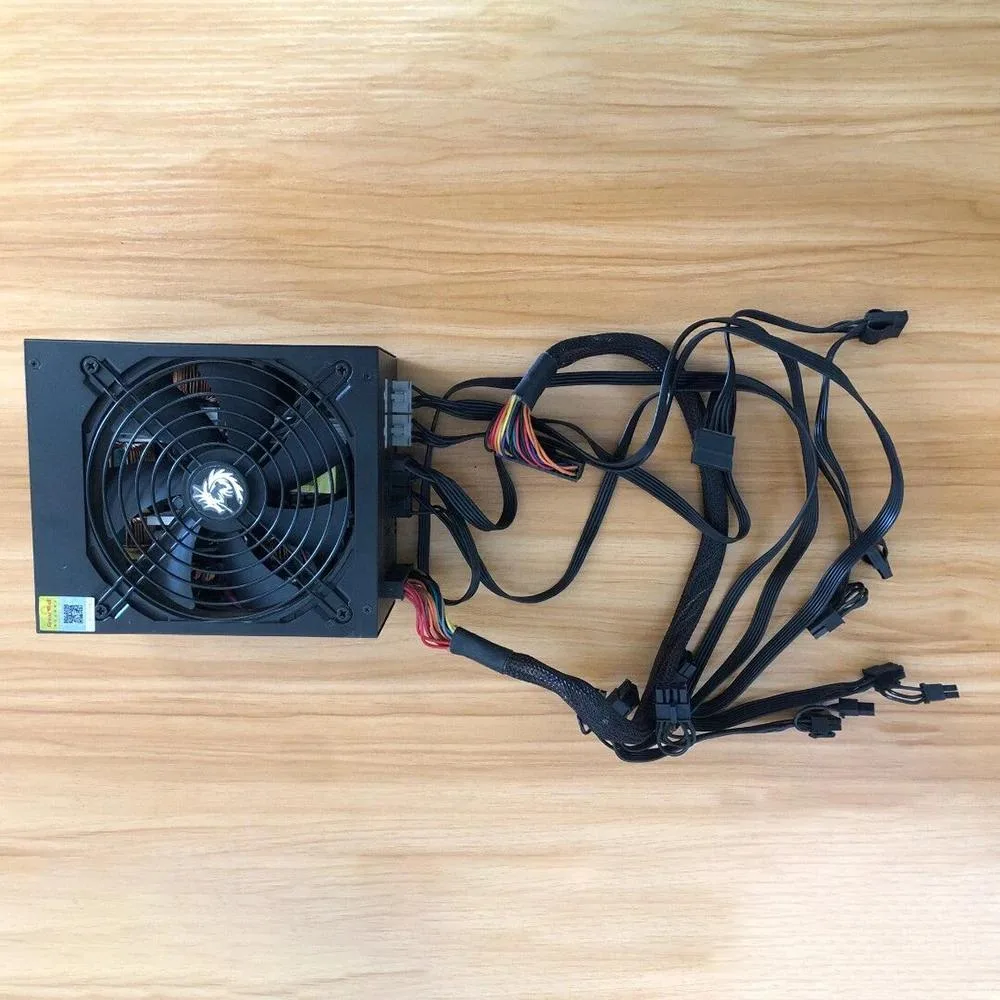Silver ATX power supply unit with modular cable connectors visible