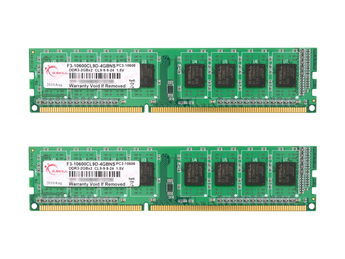 Two green DDR3 DIMMs with black heatspreaders