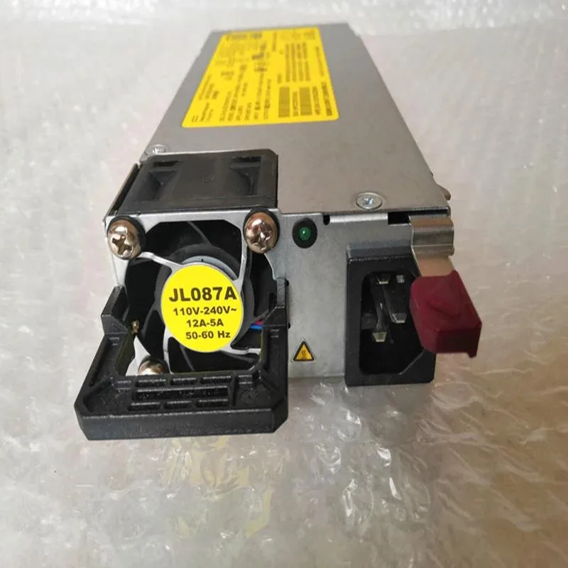 Rectangular silver metal ATX power supply unit with ventilation grilles and label showing JL087A