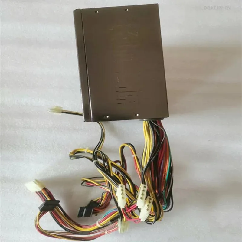 Rectangular black metal ATX power supply unit with ventilation grille and power socket visible