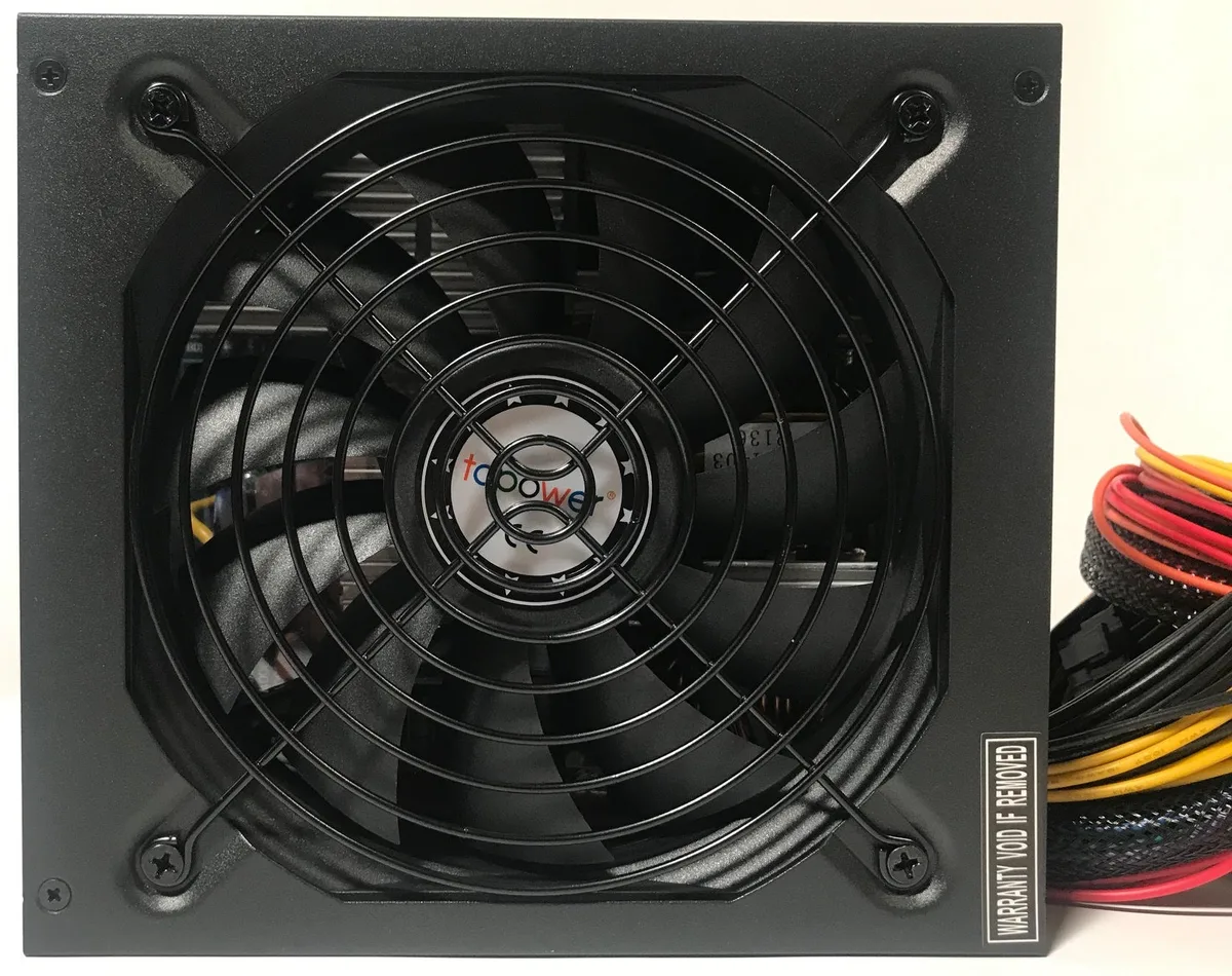 Rectangular black ATX power supply, single 135mm fan, 165mm long, non-modular cables visible