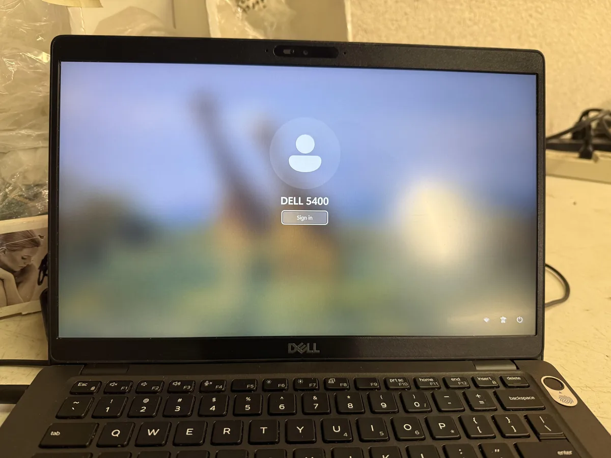 Silver Dell Latitude 5400 laptop closed showing 14 inch display and keyboard