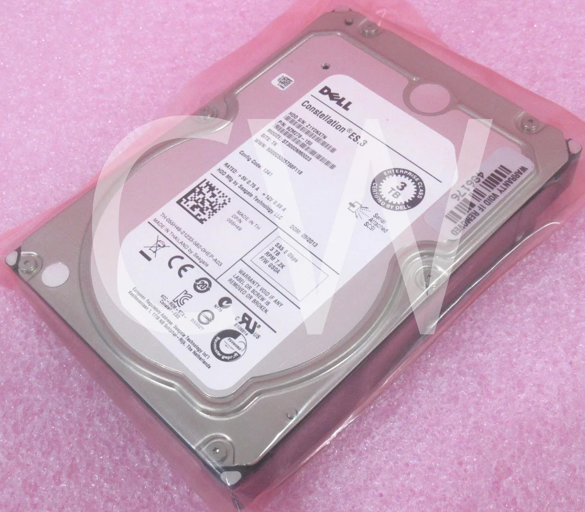Silver 3.5 inch SAS hard drive with green circuit board visible on underside