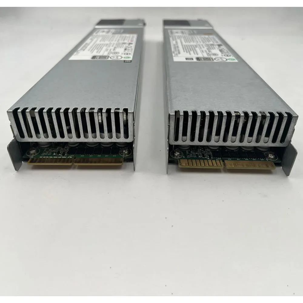 Rectangular silver server power supply unit with handle and ventilation grille