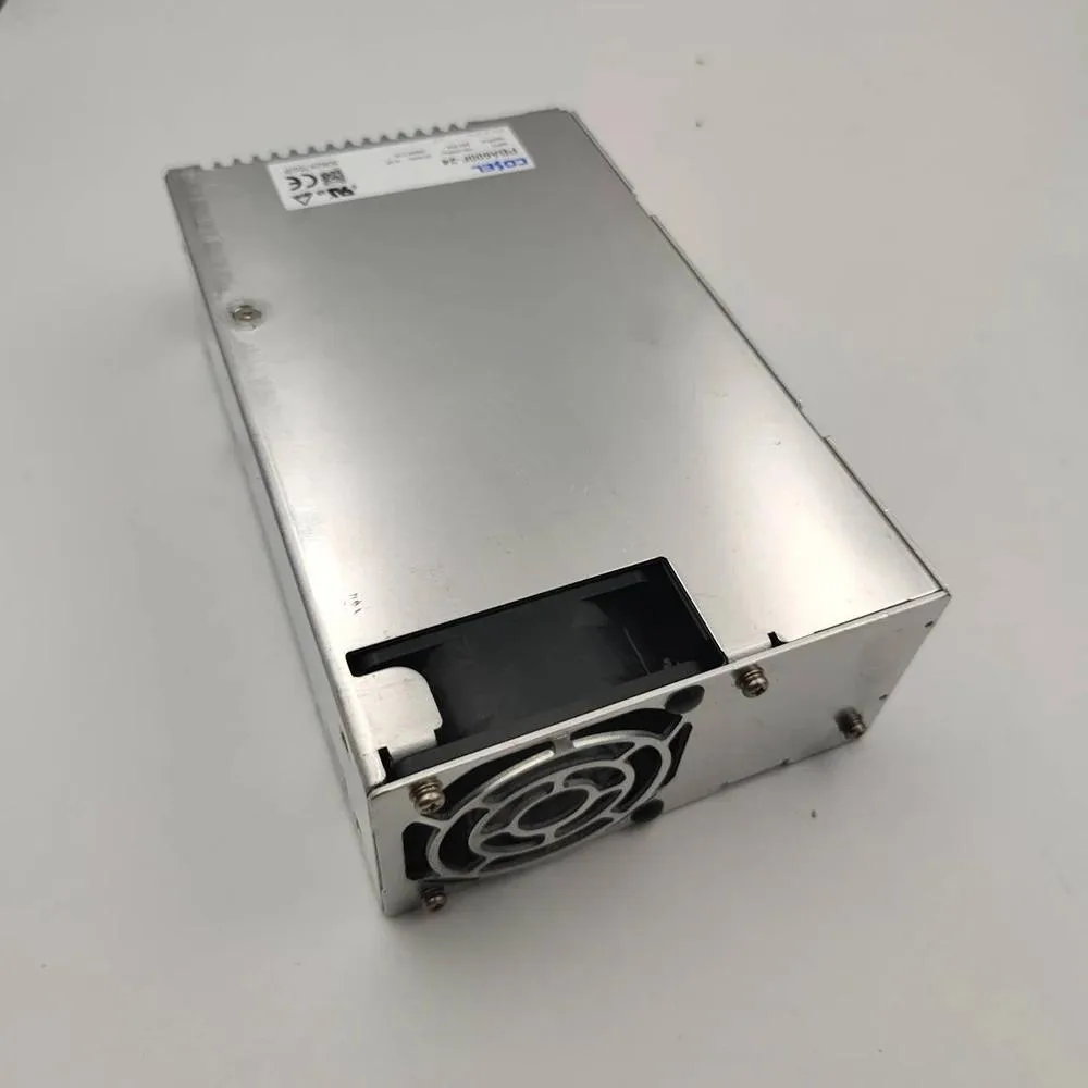 Silver ATX power supply unit with ventilation grille and label showing 600W 24V 27A