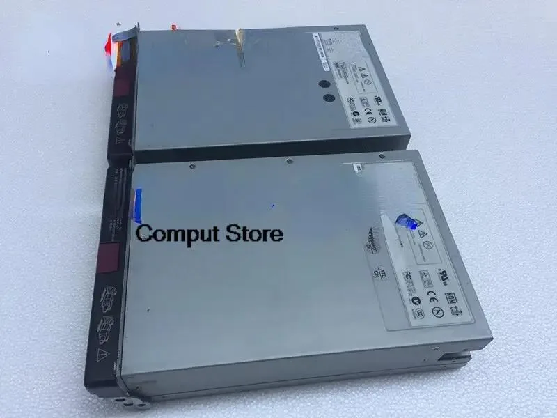 Rectangular silver server power supply unit with rear fan grille and power socket