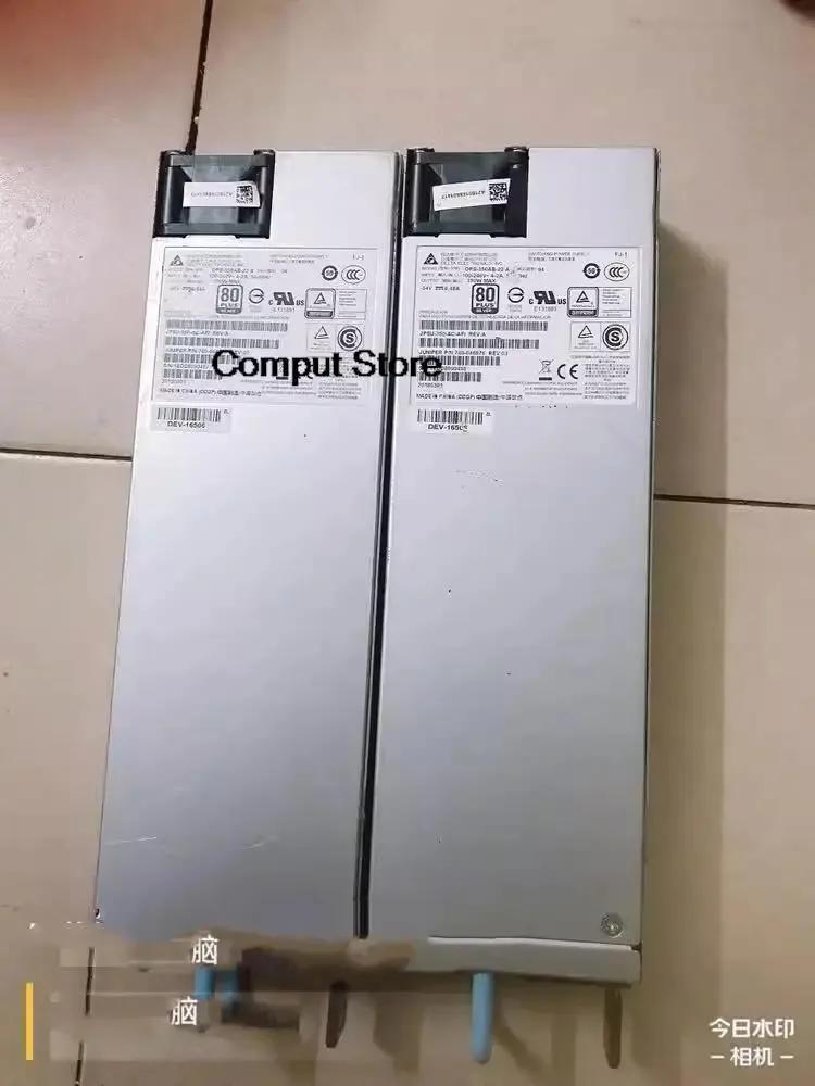 Rectangular silver ATX power supply unit with rear fan grille and power socket