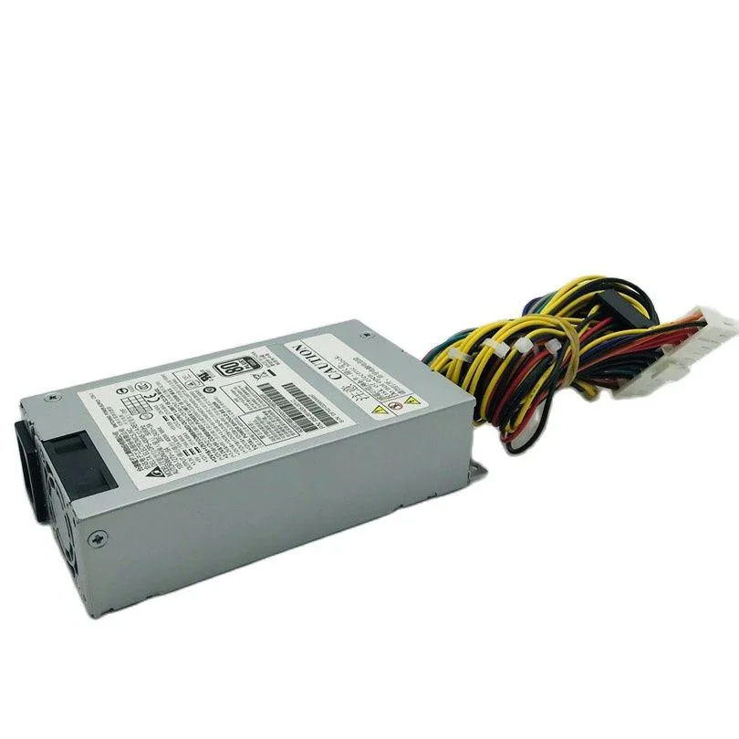Silver rectangular ATX power supply unit with fan grille and connector sockets