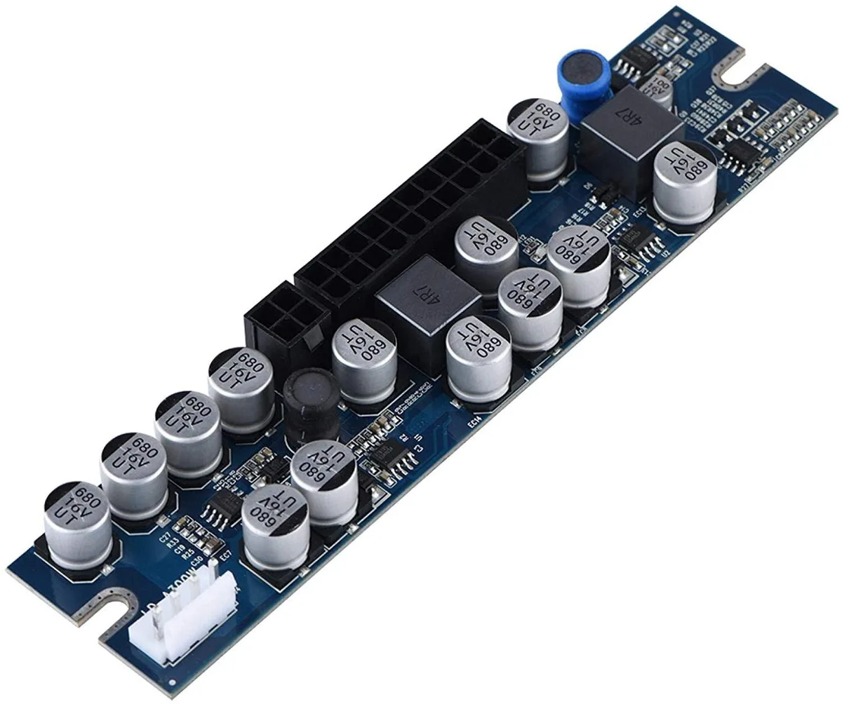 Compact rectangular 300W power module with 24-pin ATX, SATA and AUX cables, green PCB and silver capacitors