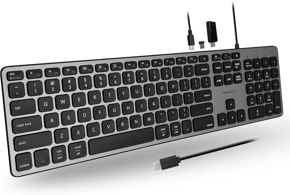 Space-grey compact 87-key keyboard with frosted metal top and two USB-A plus one USB-C ports