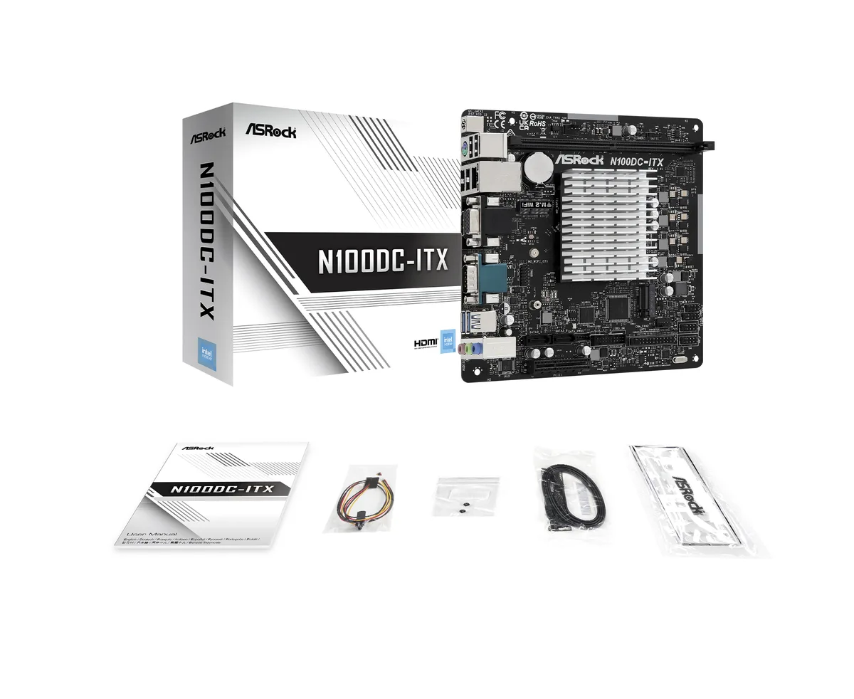 Green Mini ITX board with silver DC jack, blue DDR4 slot, black PCIe and M.2 sockets, rear I/O shield showing HDMI, D-Sub, USB, LAN