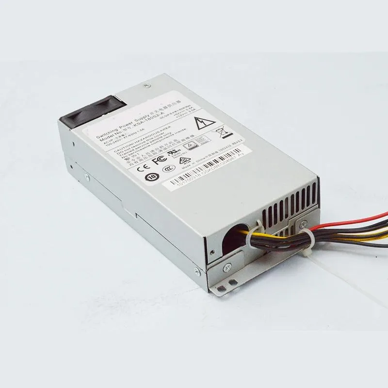 Rectangular silver ATX power supply unit with fan grille visible