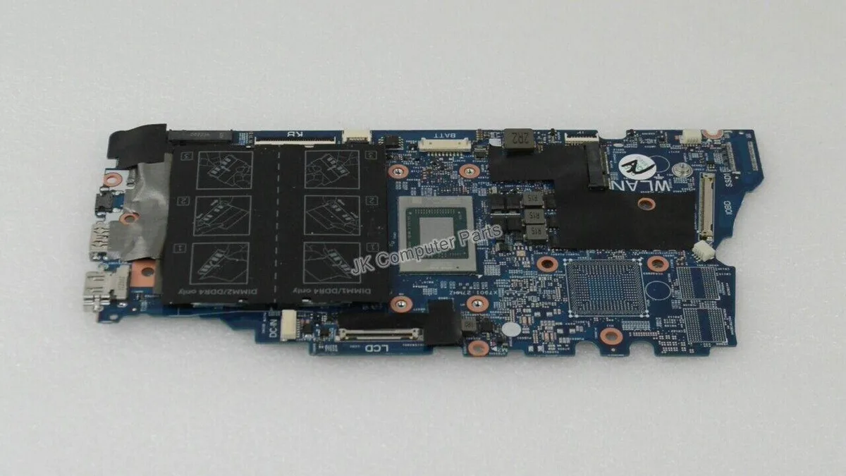 Green Dell laptop motherboard with silver components, model 7405 part NNDRC