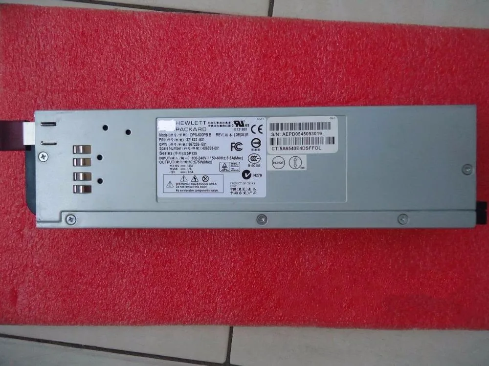 Rectangular silver metal server power supply unit with rear fan grille and power socket