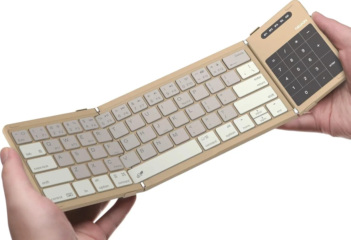 Khaki foldable keyboard with trackpad and numpad, closed size 7.1 by 4.2 in, open size 13.5 by 4 in