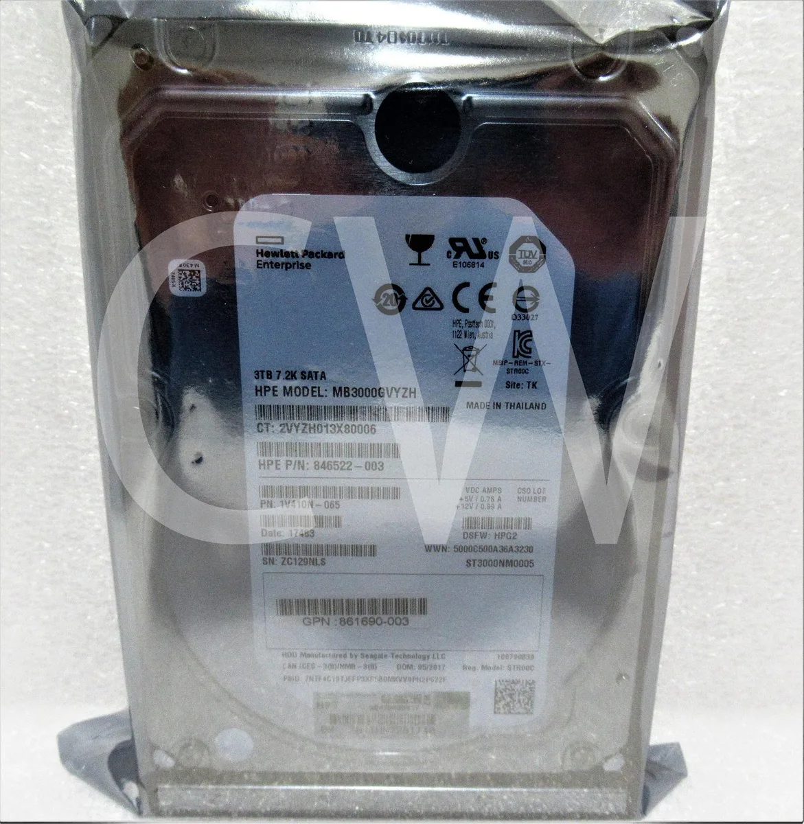 HPE 3.5 inch SAS internal hard drive, silver metal casing with label, circuit board visible on underside