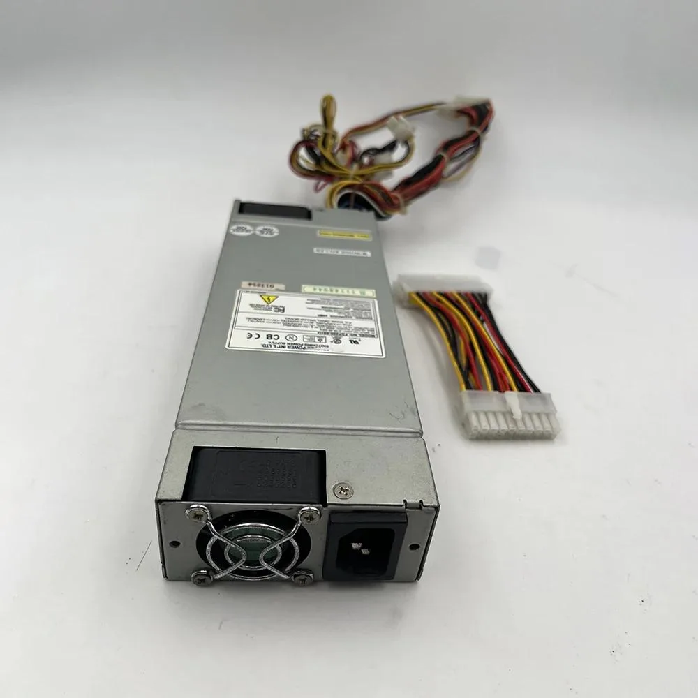 Silver rectangular ATX power supply unit with fan grille and cable bundle