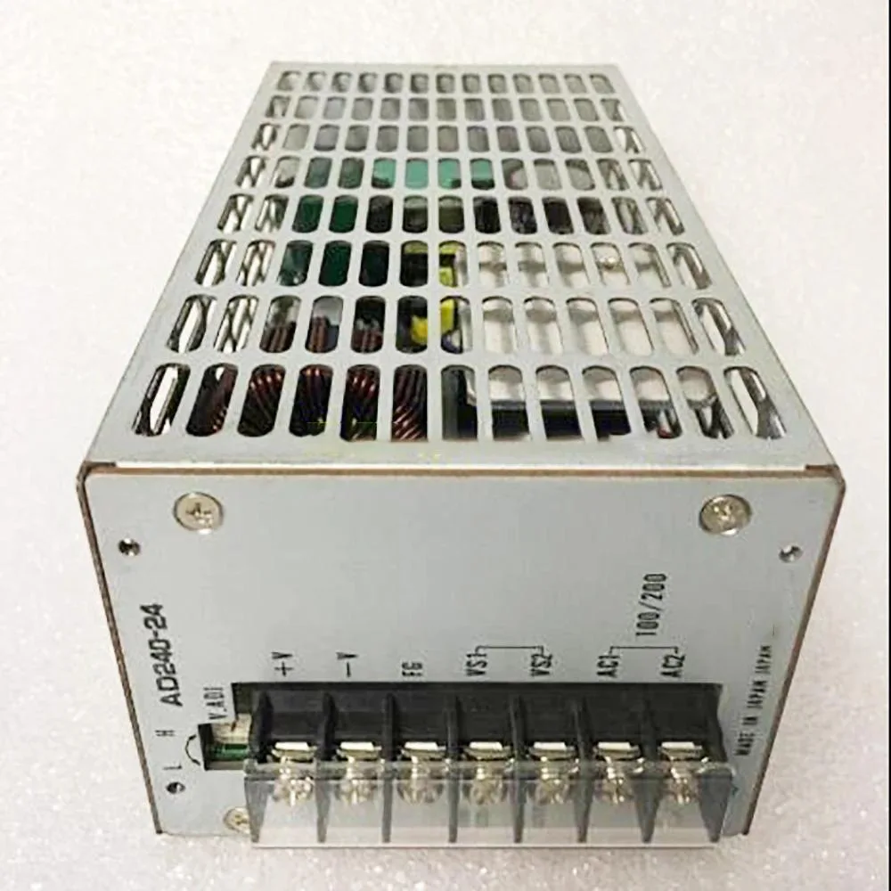 Rectangular metal power supply unit with ventilation slots and label showing 24V 10A 240W