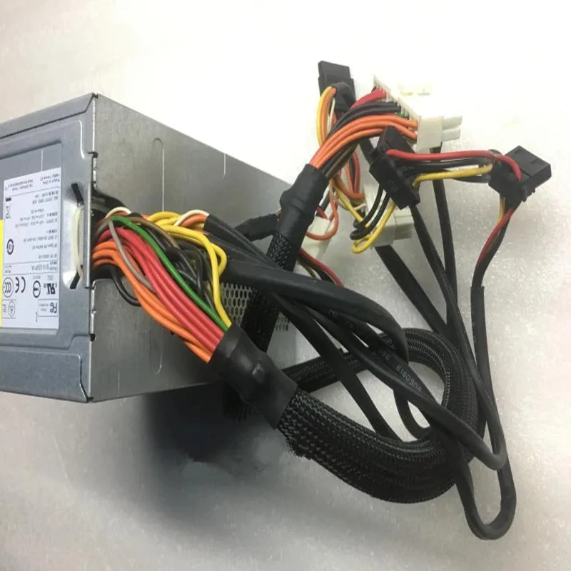 Rectangular silver ATX power supply unit with fan grille and cable bundle