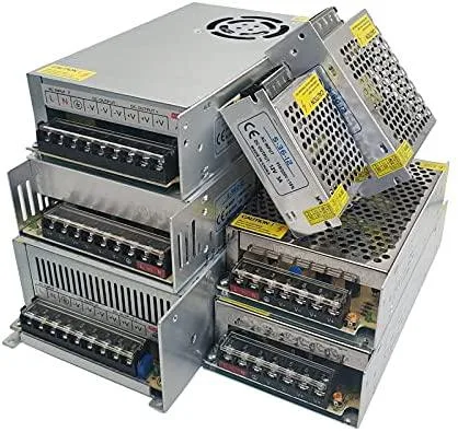 Rectangular metal power supply unit with ventilation slots and terminal connectors