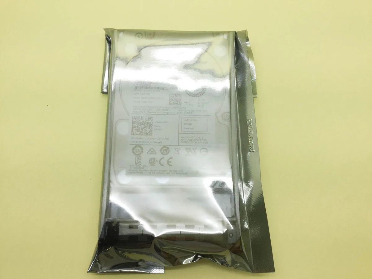 A silver 2.5 inch SAS hard drive with a circuit board on the underside