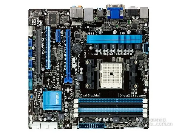 Green micro ATX motherboard with black sockets and silver heatsinks
