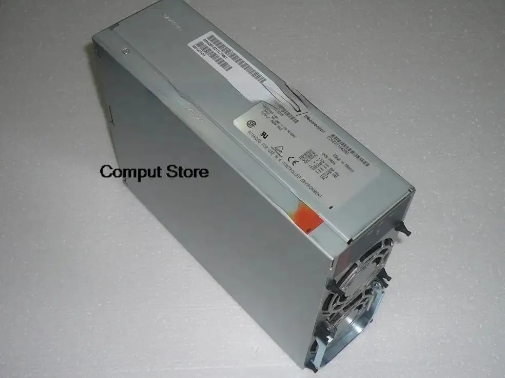 Rectangular silver ATX power supply unit with fan grille and rear connector panel