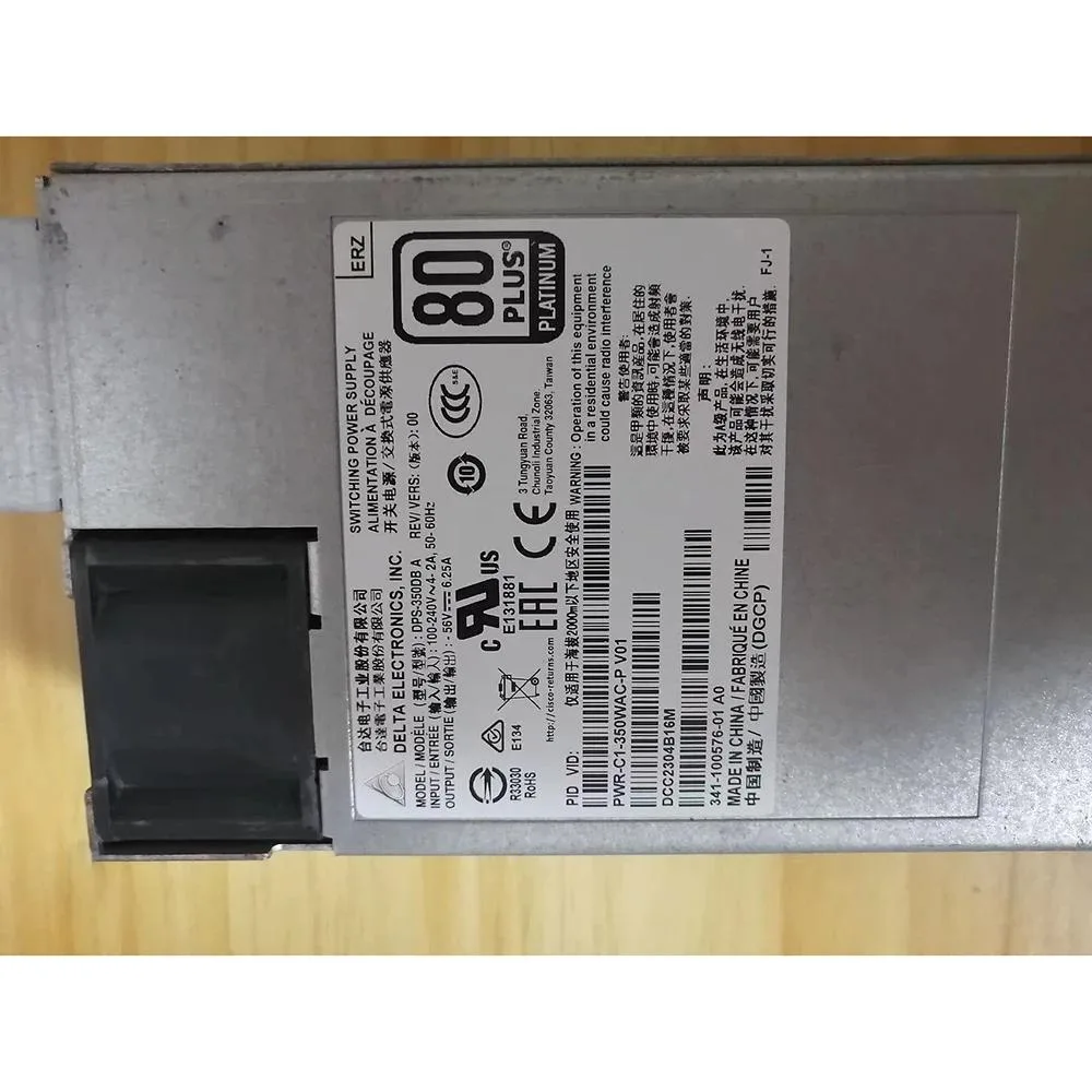 Rectangular silver metal power supply unit with ventilation grilles and gold connector pins