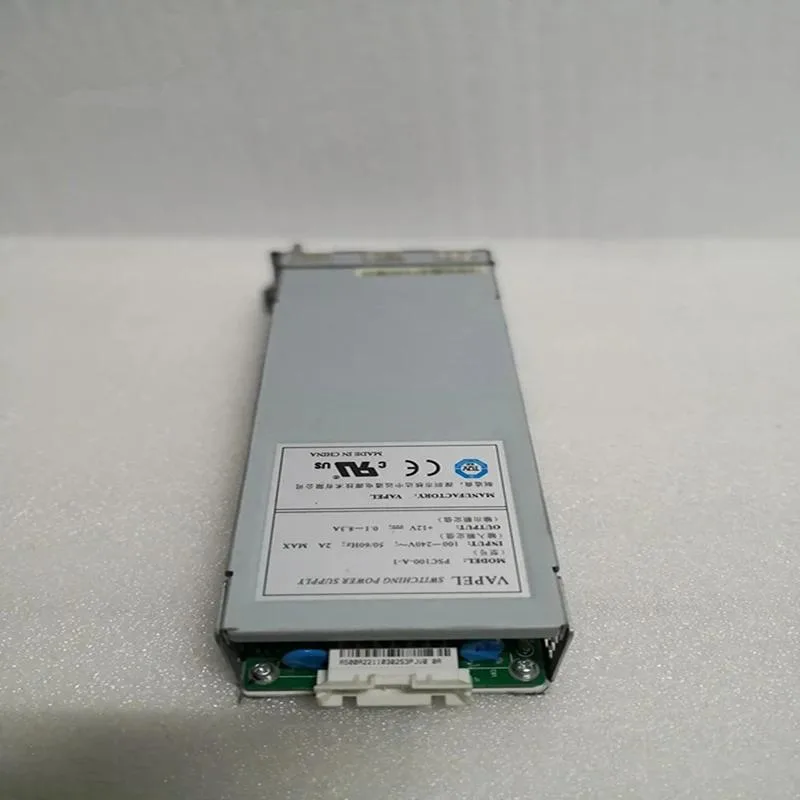 Compact silver ATX power supply unit with fan grille and cable bundle