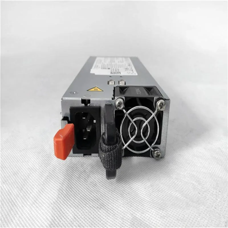 Rectangular silver ATX power supply unit with ventilation grille and cables visible