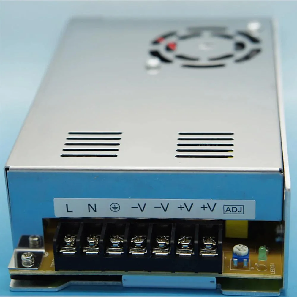 Rectangular metal power supply unit with label showing 24 VDC 14.6A