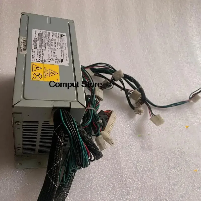 Rectangular silver server power supply unit with rear fan grille and power connector