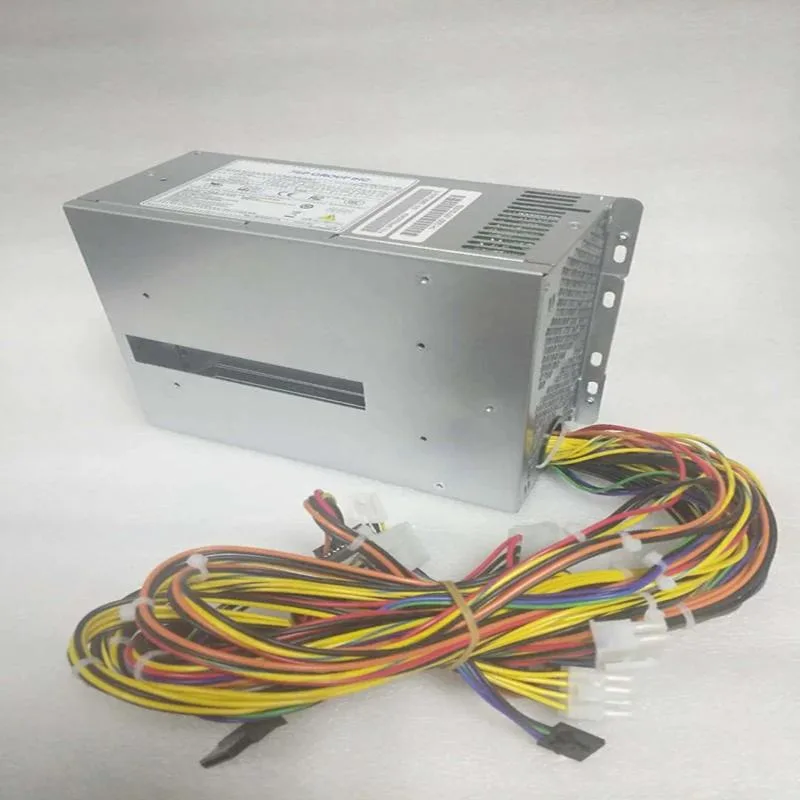 New ATX power supply unit in metal casing with fan grille and cable bundle
