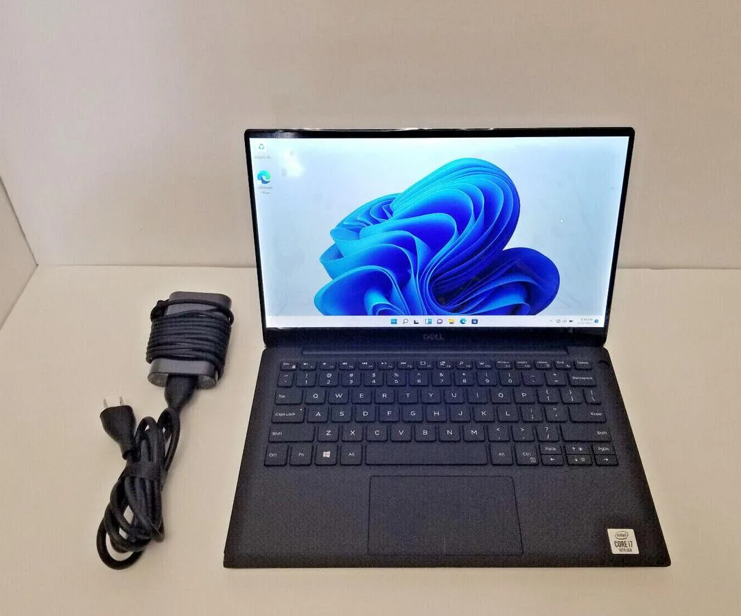 Silver Dell XPS 13 7390 laptop, 13.3 inch non-touch display, thin wedge shape .31 to .46 in, 1.29 kg