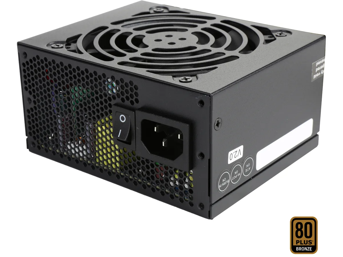 Compact SFX power supply unit, matte black metal casing, single 92mm fan grille, modular cable connectors visible
