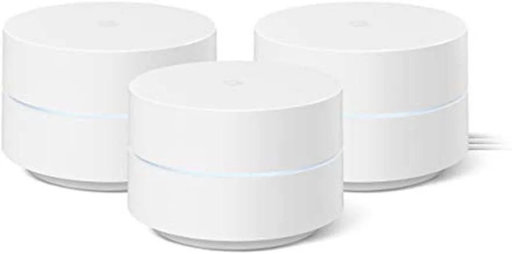 Three small white cylindrical routers with matte finish