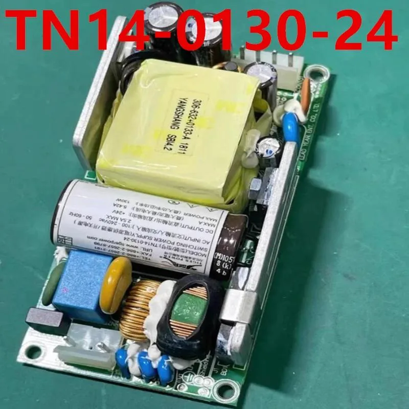 Rectangular metal power supply unit with label showing 24V 5.42A 130W