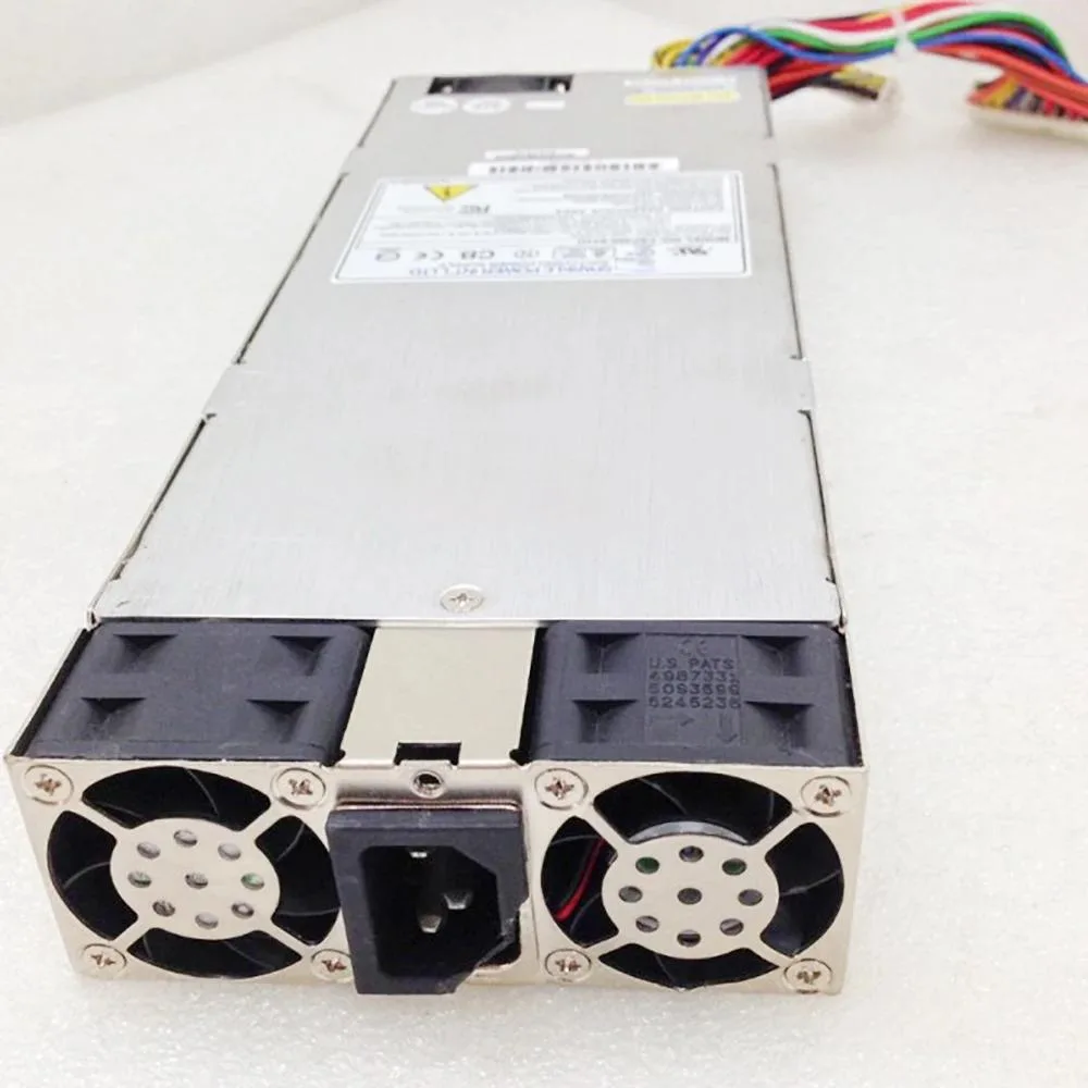 Rectangular ATX power supply unit in metal casing with fan grille and label showing 460W FSP460-631U