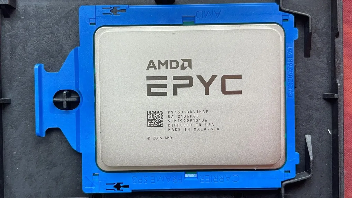 Square green ceramic processor with gold contacts and silver heat spreader, AMD EPYC 7601 model marking