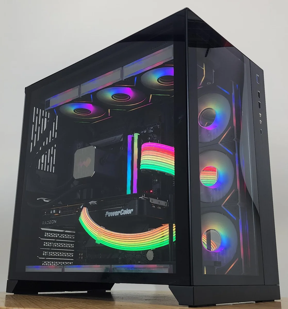 Black Lian Li O11 Dynamic ATX case with 360mm RGB AIO cooler visible through glass side panel