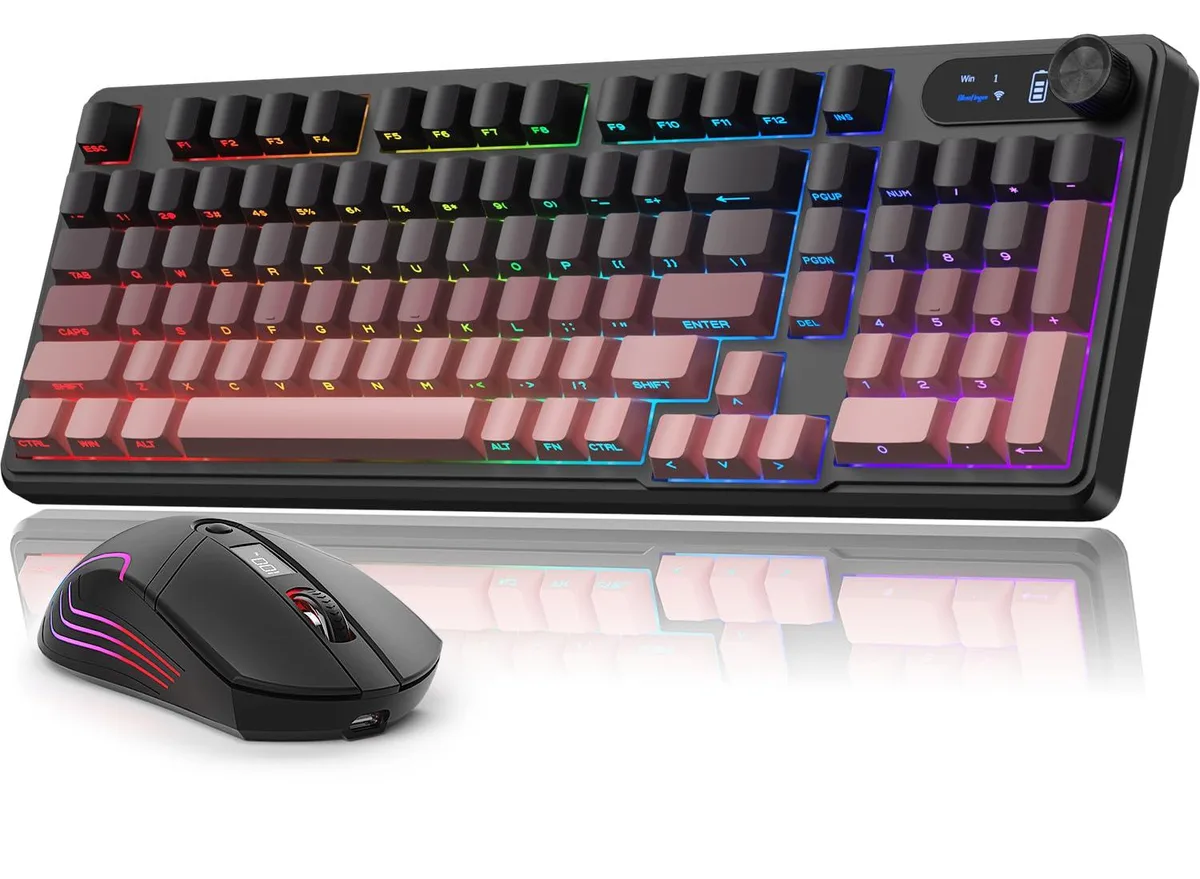 Compact 98-key keyboard with volume knob and screen beside a matching mouse, both in a dark finish