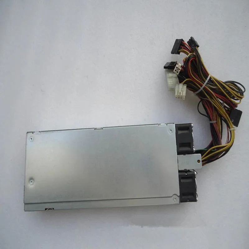 Rectangular silver ATX power supply unit with fan grille and modular cable sockets
