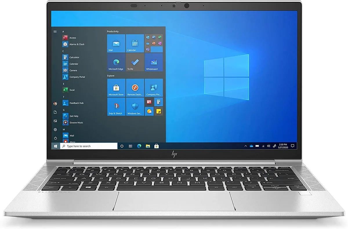 Silver 13.3 inch touchscreen laptop with minor scratches and dent