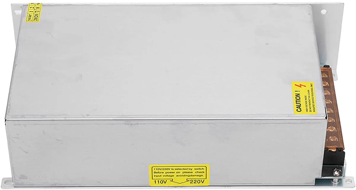 Rectangular pink aluminium power supply unit with screw terminals and adjustment knob