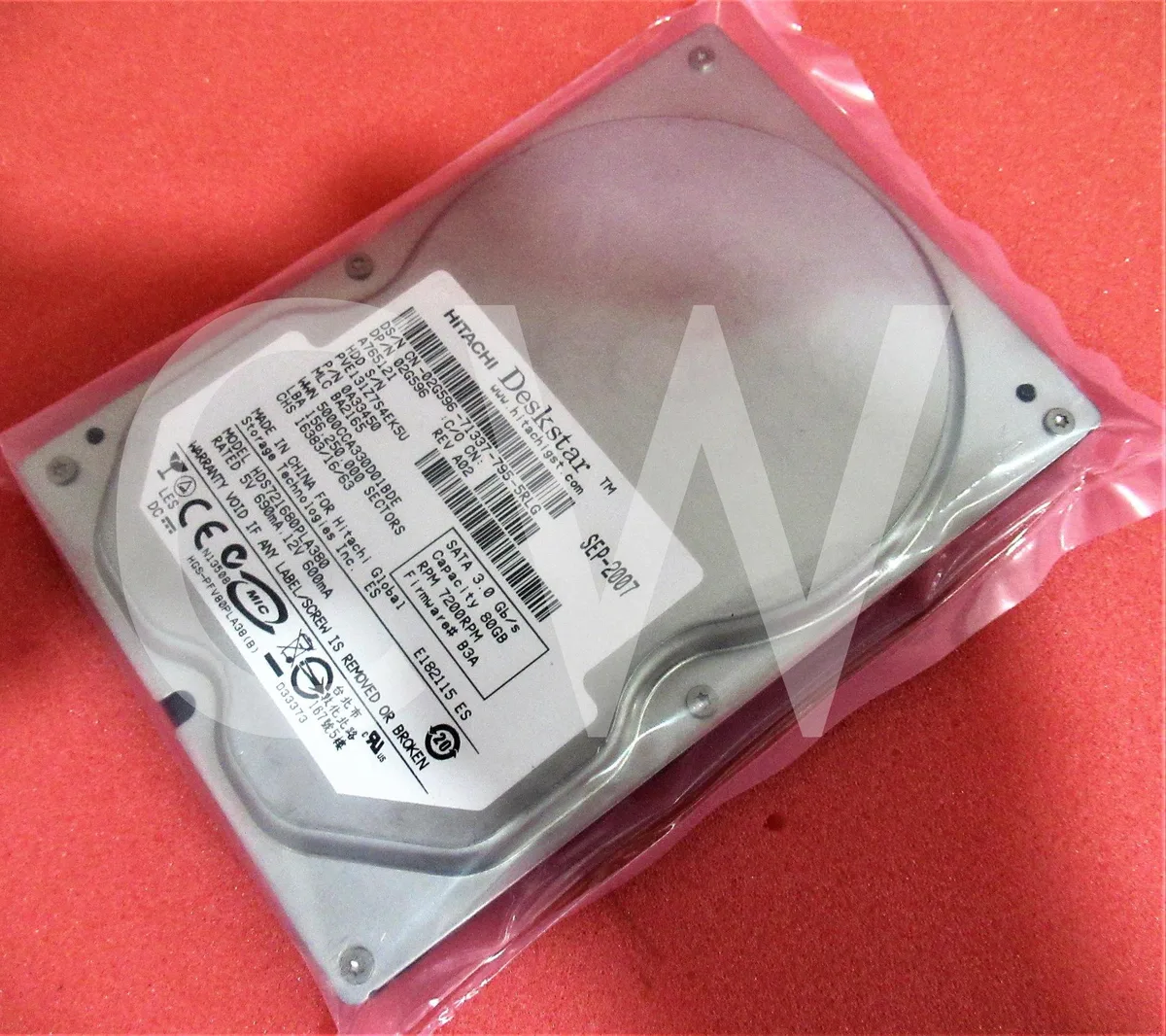Silver 3.5 inch SATA hard drive with circuit board visible