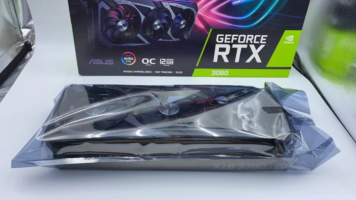 ASUS ROG Strix RTX 3060 graphics card with triple-fan cooler in dark metallic finish