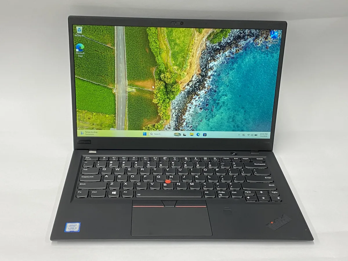 Black ThinkPad X1 Carbon 14 inch laptop closed on white background